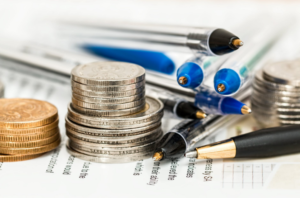 stacks of coins and reports
